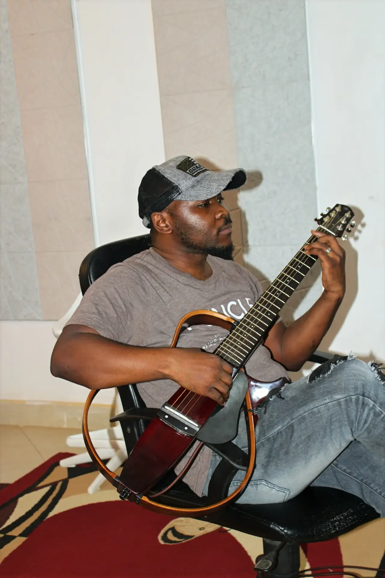 Music Producer play a Strato Guitar